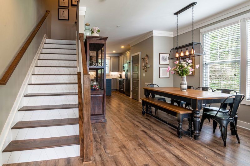 VA Home - 1 27 Bright and inviting dining area features a wooden table stai 1784048529
